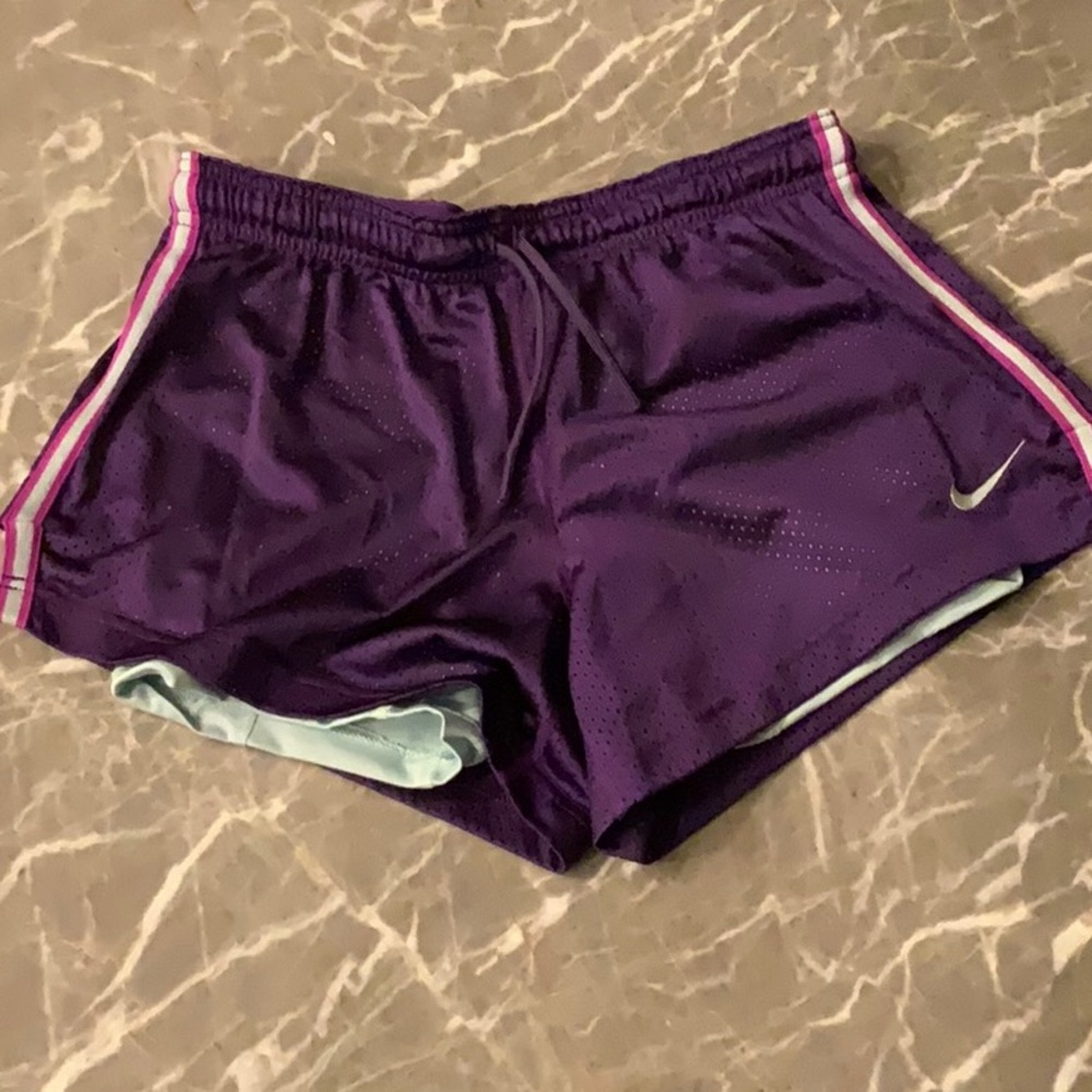 Purple Nike Pro shorts with attached spandex